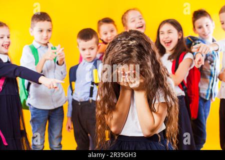 School girl being bullied by classmates. School bullying concept Stock Photo