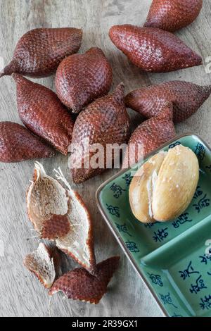 Salak on a wooden board Stock Photo