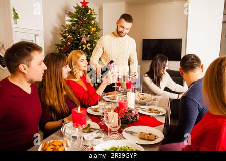 Family together selebrate the Christmas at the table Stock Photo