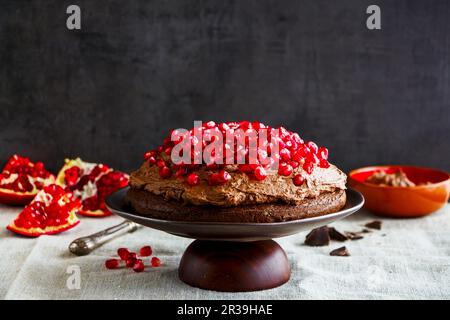 Homemade chocolate cake with mascarpone cream and fresh pomegranate Stock Photo