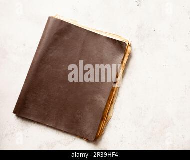 Brown old book on grunge background. Top view, copy space Stock Photo