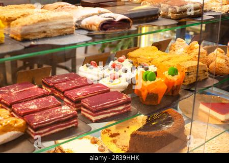 Different types of cakes pieces in pastry shop Stock Photo