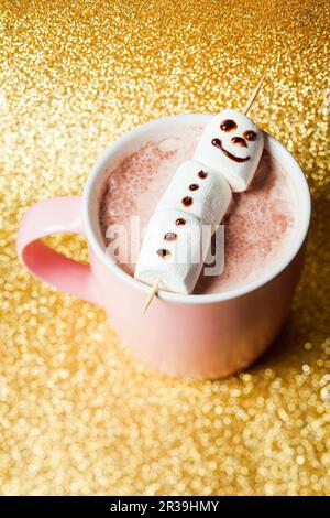 Christmas card with cup of hot chocolate with melted marshmallow snowman Stock Photo