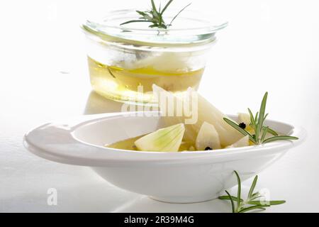 Tuscan-style pickled fennel with vinegar, white wine, onions, garlic, rosemary and pepper Stock Photo