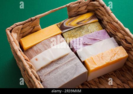 Basket with multicolored soap bars in eco shop Stock Photo