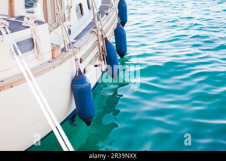 Side view of moored white small yacht Stock Photo