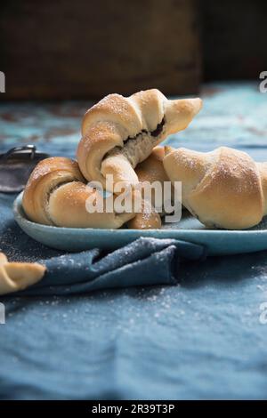 Vegan croissants filled with chocolate and peanut butter cream Stock Photo