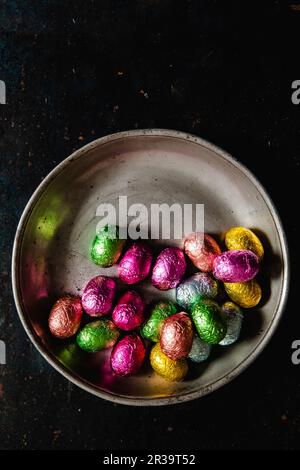 Chocolate eggs wrapped in bright foil Stock Photo