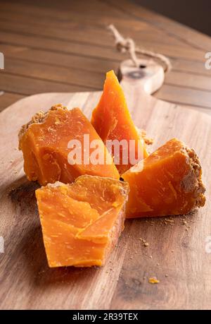 Mimolette or Boulet de Lille. French hard or semi-hard cheese in the form of a ball of orange color with a rough rind. High quality photo Stock Photo