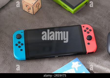Nintendo Switch video game console in a home living room. No people. Stock Photo