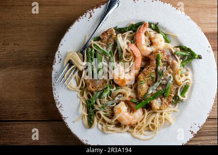 Pasta with shrimp and asparagus Stock Photo