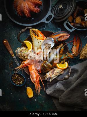 Seafood, fresh and cooked, with oranges and spices Stock Photo