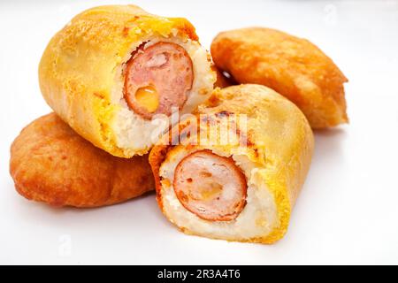 Traditional South African Russian sausage Sputnik or deep fried mash covered sausage. Isolated on white Stock Photo