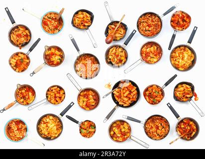 A collage of pasta pans with tomatoes Stock Photo