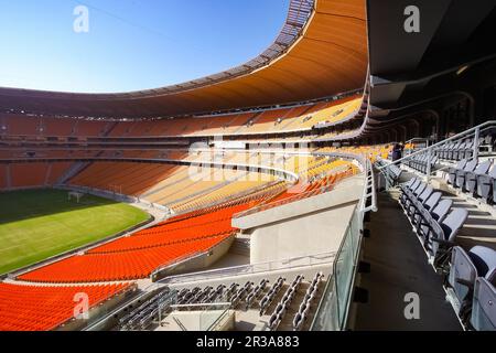 Empty Soccer Football stadium with orange seating Stock Photo