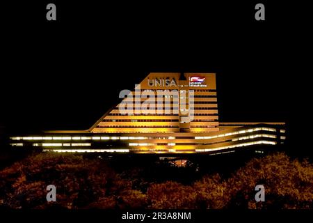 Night time view of UNISA main building with lights on Stock Photo