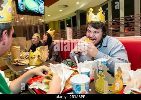 Male customer eating  at a Burger King Restaurant Stock Photo