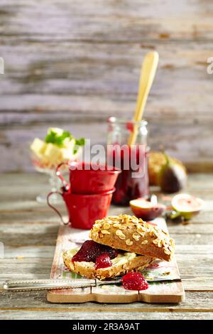 Sour cherry and fig jam on wholemeal bread with butter Stock Photo