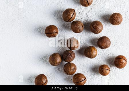 Macadamia nuts scattered Stock Photo