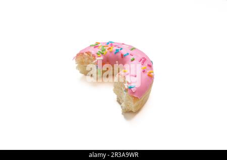 Edited photo. Messy strawberry doughnut isolated on white background. Stock Photo