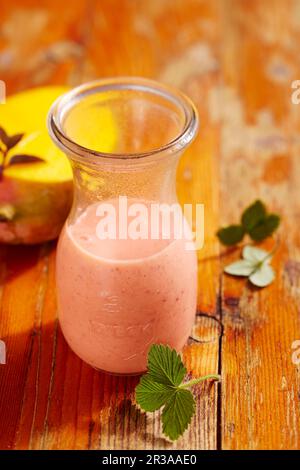 Mango and strawberry smoothie with yogurt and vanilla Stock Photo