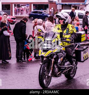 Sandnes, Norway, May 17 2023, Norwegian Policeman Riding Motorcyle During National Day Parade Celebrations Stock Photo