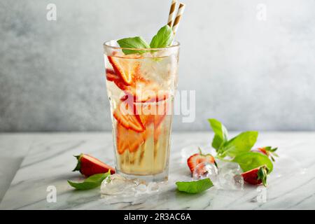 Iced green tea with strawberries and basil Stock Photo
