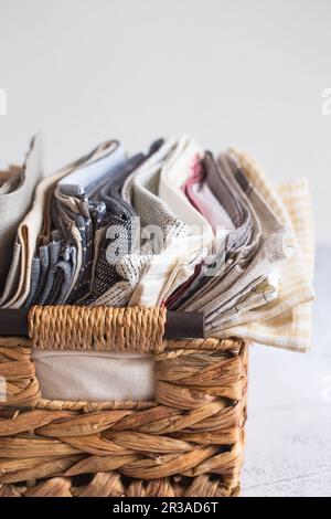 Kitchen textile. stack of fabrics in different colors and textures, close-up. Kitchen towels on whit Stock Photo