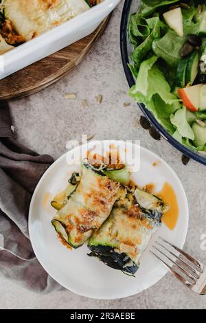 Courgette rolls with a mixed leaf salad Stock Photo