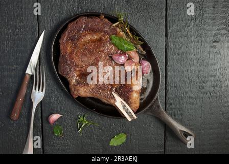 Ribeye steak in cast iron pan Stock Photo