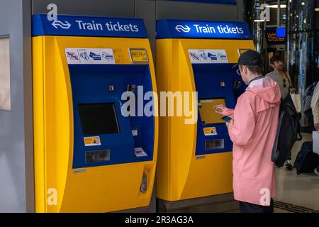 Amsterdam, The Netherlands - 8 September 2022: Passenger buys ticket in the Central railway station in Rotterdam Stock Photo