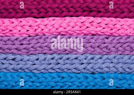 Macro horizontal rows of multicolor woven braids Stock Photo