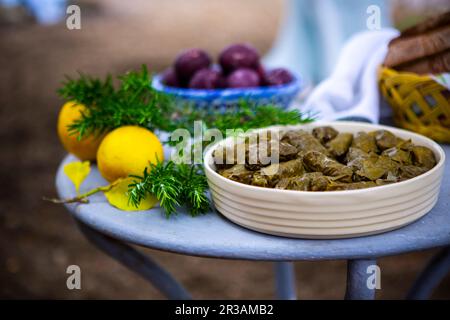 easter table with dolmas, easter eggs and freshly baked bread Stock Photo