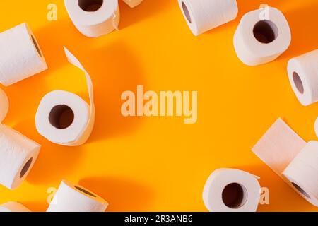 Top view of toilet paper rolls frame on the yellow Stock Photo