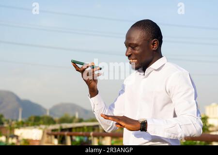 young handsome african man making call with his mobile phone Stock Photo
