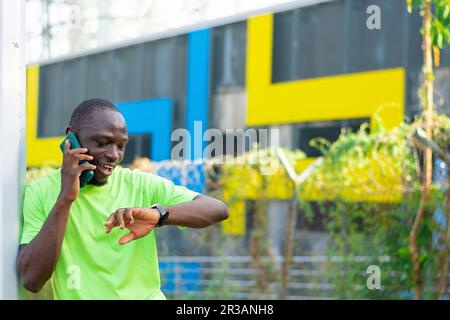 excited black man making phone call Stock Photo