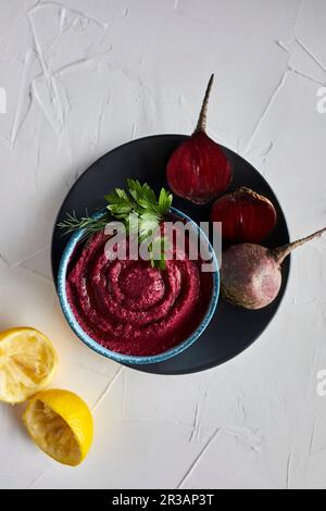 Beetroot hummus in a bowl Stock Photo
