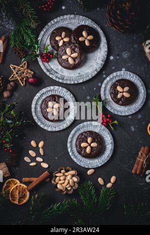Chocolate Elisenlebkuchen (Nuremberg gingerbread cake) on metal plates Stock Photo