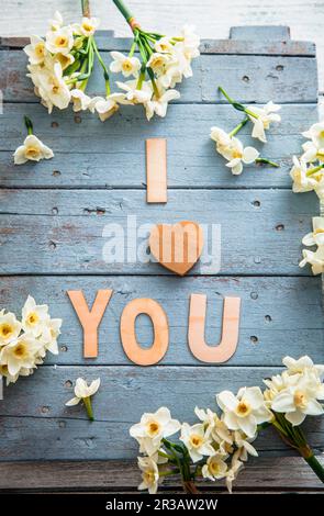Spring table setting with narcissus flowers Stock Photo