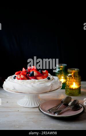 Pavlova with strawberries and blueberries Stock Photo