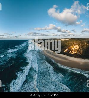 Aerial Drone View of 75 mile beach, Fraser Island, Queensland, Australia. Shot during Sunrise with red canyon. Stock Photo