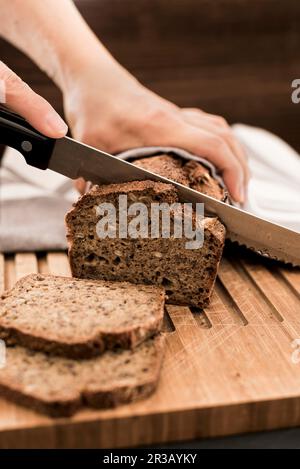 Home-baked wholegrain bread cut into slices Stock Photo