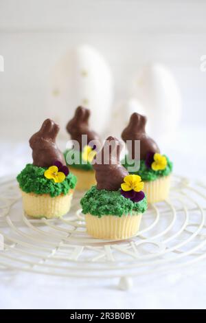 Easter cupcakes decorated with chocolate Easter bunnies Stock Photo
