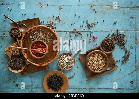 An arrangement of various types of peppers in bowls Stock Photo