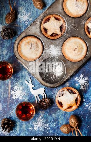 Overhead view of Mince Pies in Vintage Baking Tins Stock Photo