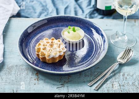 Lemon Meringue Pie with ice cream and mint leaves Stock Photo