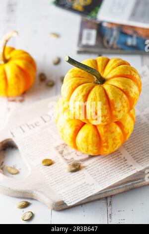 Still life composition with colorful decorative mini pumpkins. Mini orange pumpkins, holiday decorat Stock Photo