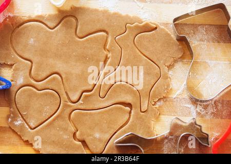 Cooking and decorating christmas gingerbread. Homemade gingerbread cookies, forms and baking ingredi Stock Photo