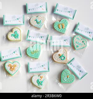 Motif cookies for a baby party, packed in sachets for gifting Stock Photo