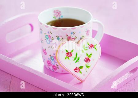 Heart cookies hand-painted with floral motifs Stock Photo